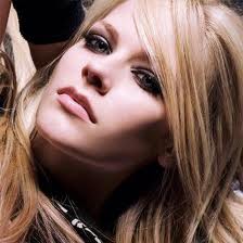 Avril Lavigne with her blue eyes in smokey eye makeup