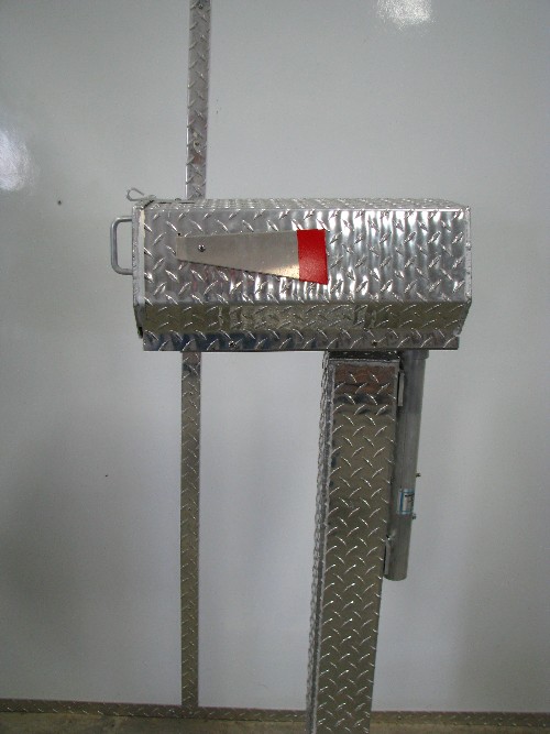 Heavy duty vandal and snow plow resistant mail box with swing arm and post protector.