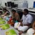 Having Onasadhya ( lunch in traditional way in banana leaf) inside the office