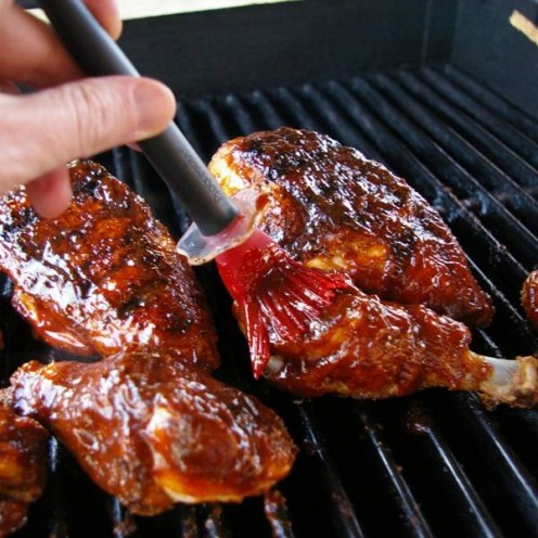 Putting Barbecue Sauce on Chicken
