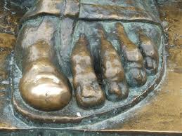 The massive sculptor is the work of Ivan Meštrović.   There are only 3 original Grgur Ninski's in the world.  People like to touch his big toe and make a wish :) 