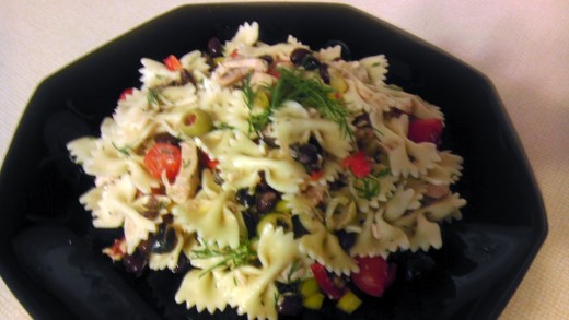 This pasta salad with tuna, tomatoes, and two kinds of olives will be a hit with family and friends.