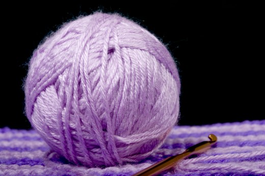 BALL OF YARN by Dennist1 DESCRIPTIONBall of yarn sitting on crochet work with hook
