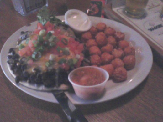 Black bean open-faced pita sandwich and "to die for" sweet potato tots 