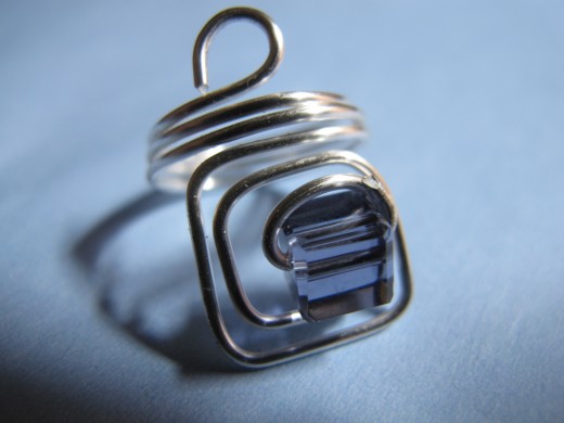 Square ring with purple crystal