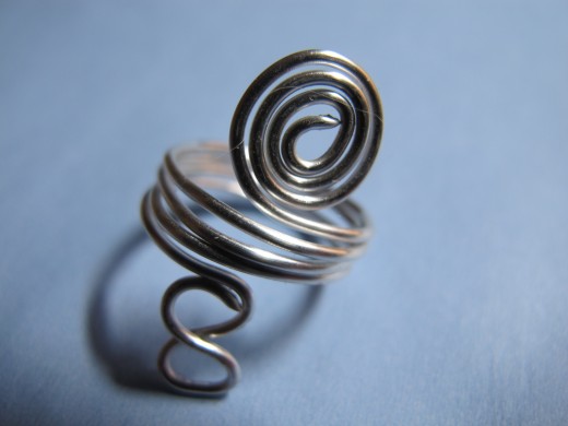 Spiral ring with infinity symbol