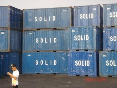 Container vans that has "SOLID" written on it in Manila Harbor 