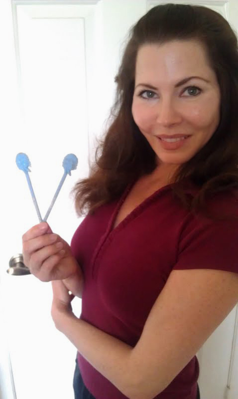 Holding two of the swizzle sticks 42 years later.