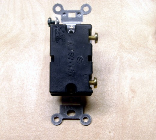 A more expensive, 20 amp switch.  The ground screw is at the top left, the two other wires attach to the brass colored screws on the right.
