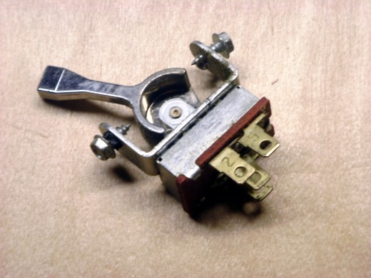 This toggle switch has 4 positions, including off; the line wire can be connected to any of 3 loads, one at a time or none in the off position.  Wires must be soldered into place.