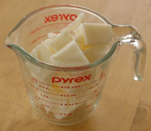 White melt and pour glycerin soap base cut into chunks and placed in a Pyrex® measuring cup.