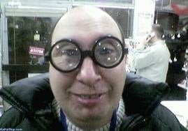 Man with coke-bottom glasses
