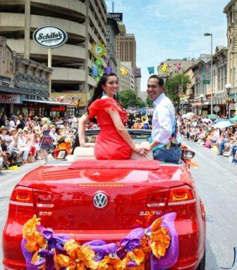Downtown San Antonio, Mayor Julian Castro and his wife ride in the Battle of Flowers Parade 2012.