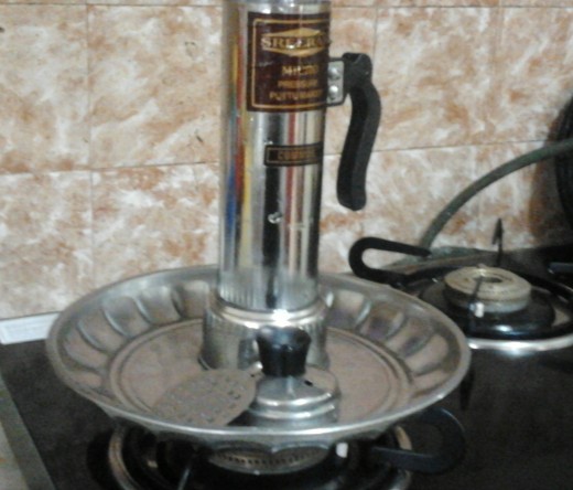 Puttu Maker and the filter, placed in a plate