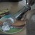 once cooked,  use a stick to push the puttu, out from the puttu maker to a plate