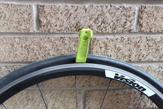 Your tyre lever should be inserted between the tire and hooked rim and point directly outwards
