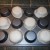 Press the biscuit dough around the bottom form of the muffin pan. Push out any air bubbles and press the edges down firmly. Press the biscuit dough around the bottom form of the muffin pan. Push out any air bubbles and press the edges down firmly.