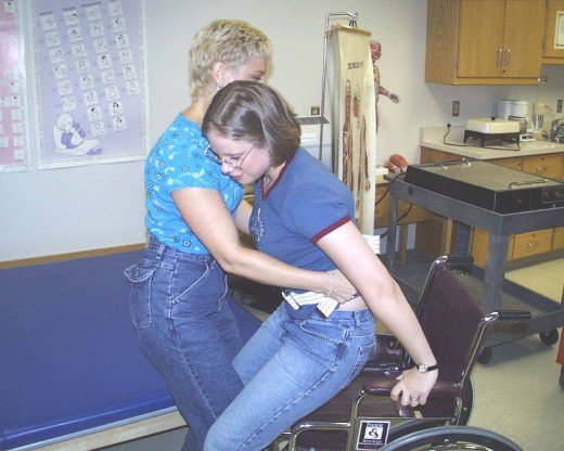 An occupational therapist assisting a disbled patient.