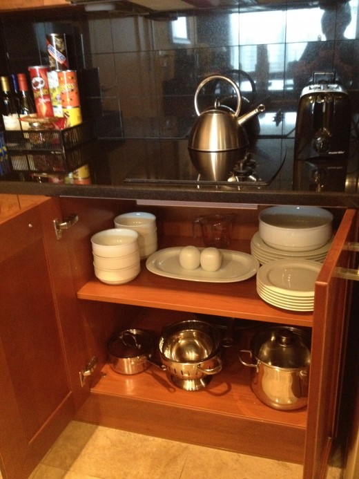 The Kitchen cabinets contained all the necessary cookware, dishes and small appliances to make a meal. 