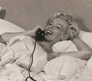 The iconic Model 302 has been a part of many movies and TV shows during 50's, 60's and 70's. In picture is Marilyn Monroe lying on the bed, seemingly engrossed in a candid chat while she holds a handset similar in design to Moshi Moshi.