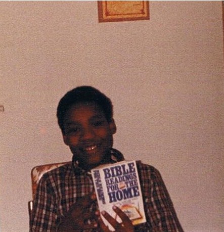 Author in 1982 holding "Bible Readings for the Home" distributed by SDA.