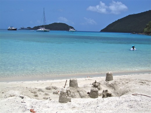 Sand castles and a peaceful view of Big Maho Bay on a quiet day