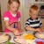 The kids are enjoying creating their own sandwiches. The kids are enjoying creating their own sandwiches.