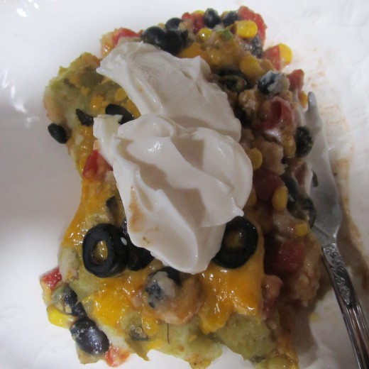 My serving of spicy vegetarian enchiladas with a double dollop of sour cream!
