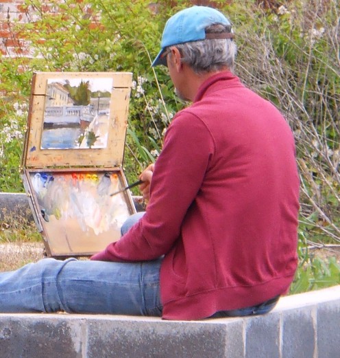 David Diaz painting a riverfront scene in Historic Milton. 