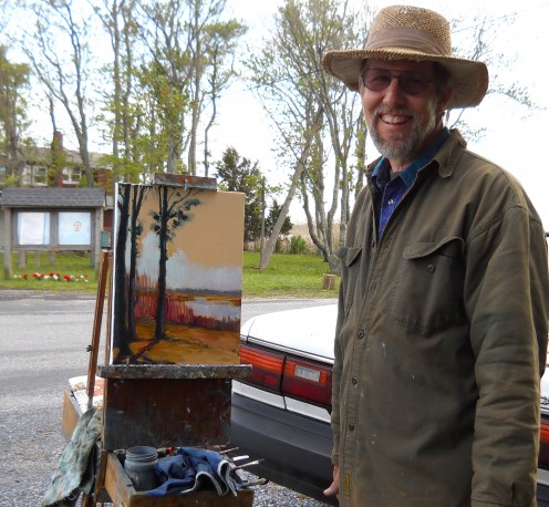 Jim posing in front of his painting. 