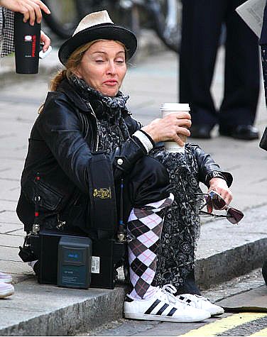 Madonna loses her "Material Girl" image in this apparently candid photo. Actually, she's playing homage to Lucille Ball in "Stone Pillow." 