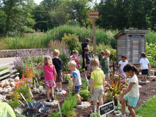 Grace and Alex explore an alphabet garden.