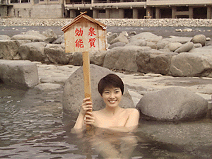A woman enjoying a hot spring.
