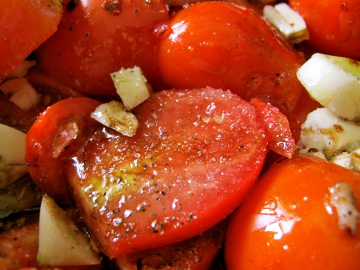 Mix tomatoes with balsamic, garlic, oregano, salt and pepper before roasting.