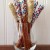 Large pretzel rods dipped in white chocolate; red, white & blue jimmies; and gold sugar gems