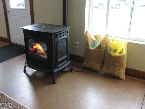 Example of a wood burning stove. No, it is not lit when the bird appears inside.