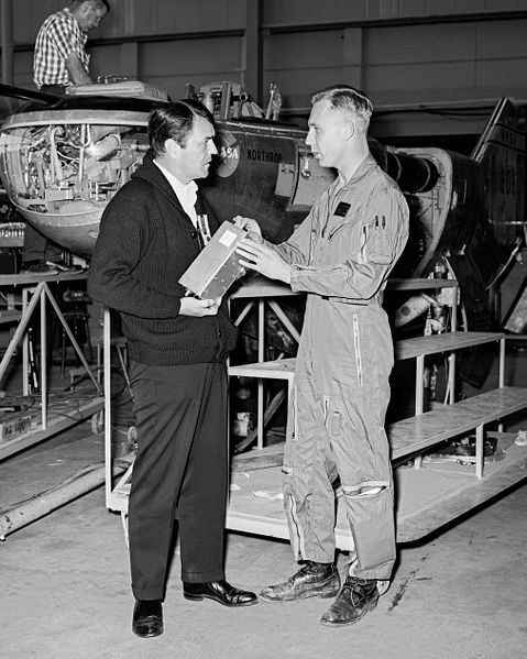 James Doohan (left) visiting NASA Dryden Flight Research Center at Edwards, California, is discussing the M2-F2 Lifting Body with NASA pilot Bruce Peterson