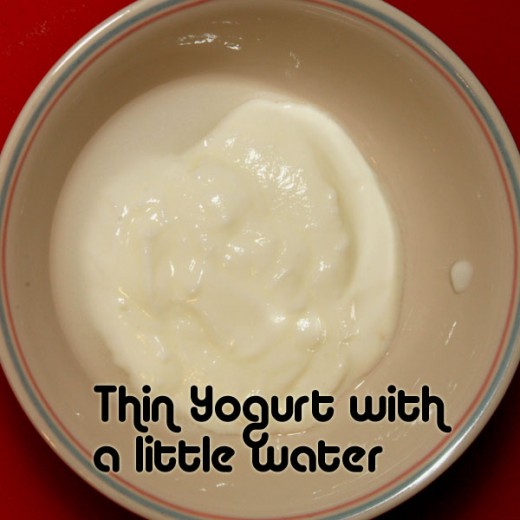 Add a little water to the yogurt to thin.