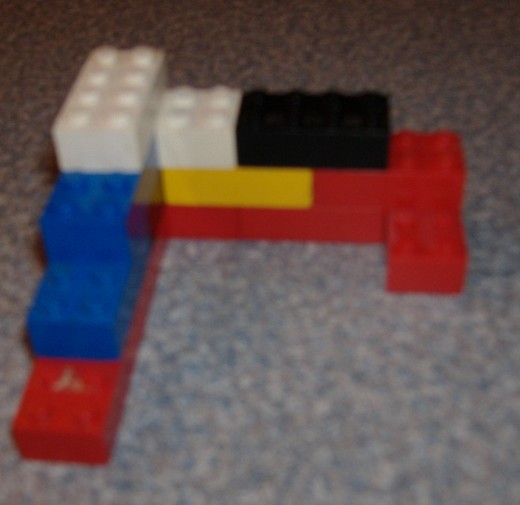Toys like Legos, Tinker-toys, and Lincoln logs can be great for making miniatures of projects.