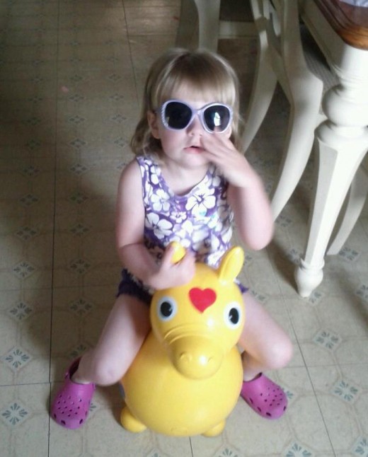 My two-year old granddaughter riding Rody