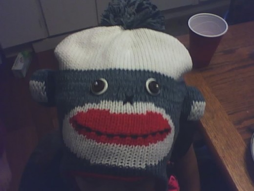 My young neighbor wearing a sock monkey cap! 