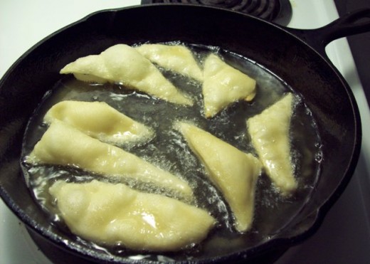 Cook sopapillas on each side for about 2-3 minutes, or until golden.