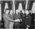 Fr. O'Callahan (far right) being presented the Medal of Honor with 3 others by President Truman. Next to O"Callaghan is LtJg Donald Gary who also won his Medal of Honor aboard the Franklin that day. He rescued more than 300 trapped men below deck.