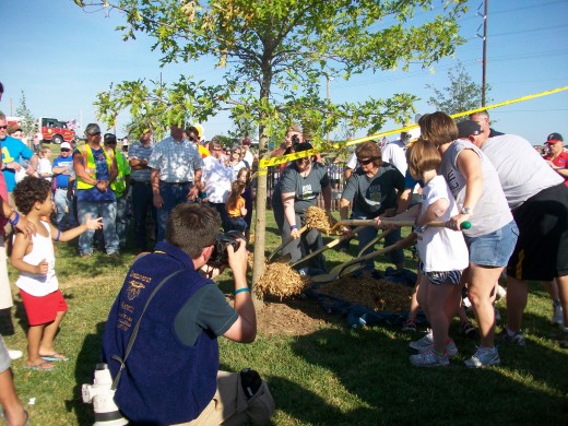 Ceremony dedicating the last of 161 trees planted in the park to commemorate those who died in the tornado.