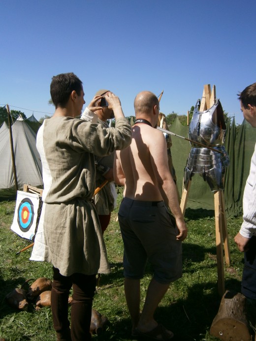 Nope, the arrow shatters. The fourth shot results in another deflection into the other side of the armour. Still no wound.