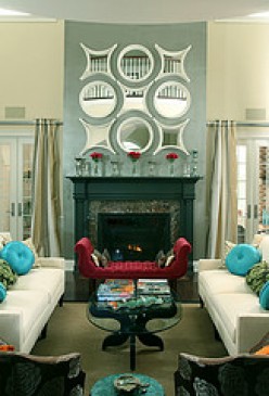 The fireplace and mirror collection exemplifies emphasis in a room.