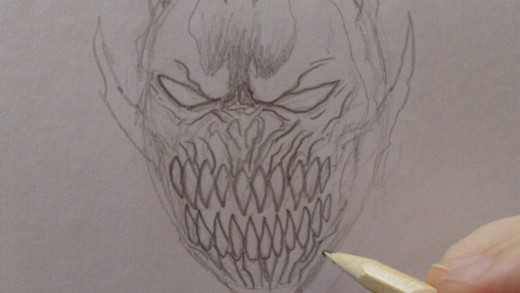 Continue to darken and define the design.