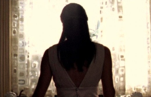 Eve Goode doing the dishes and thinking sinister thoughts