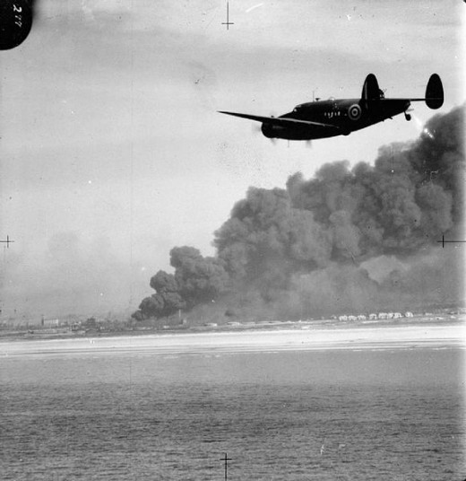 A Lockheed Hudson of No. 220 Squadron RAF approaches Dunkirk on a reconnaissance patrol during the evacuation of the British Expeditionary Force.