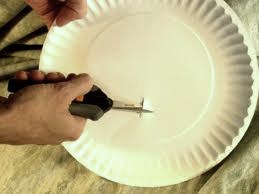 Cut the hole off center. This aides you to balance the plate to the shape of the head.  
